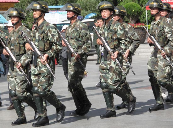 Chinese soldiers dealing with Tibetan protest